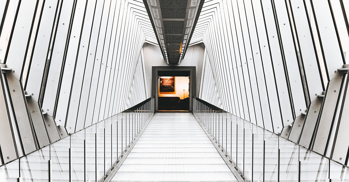 Gray hallway. Photo by Matheww Hamilton on Unsplash